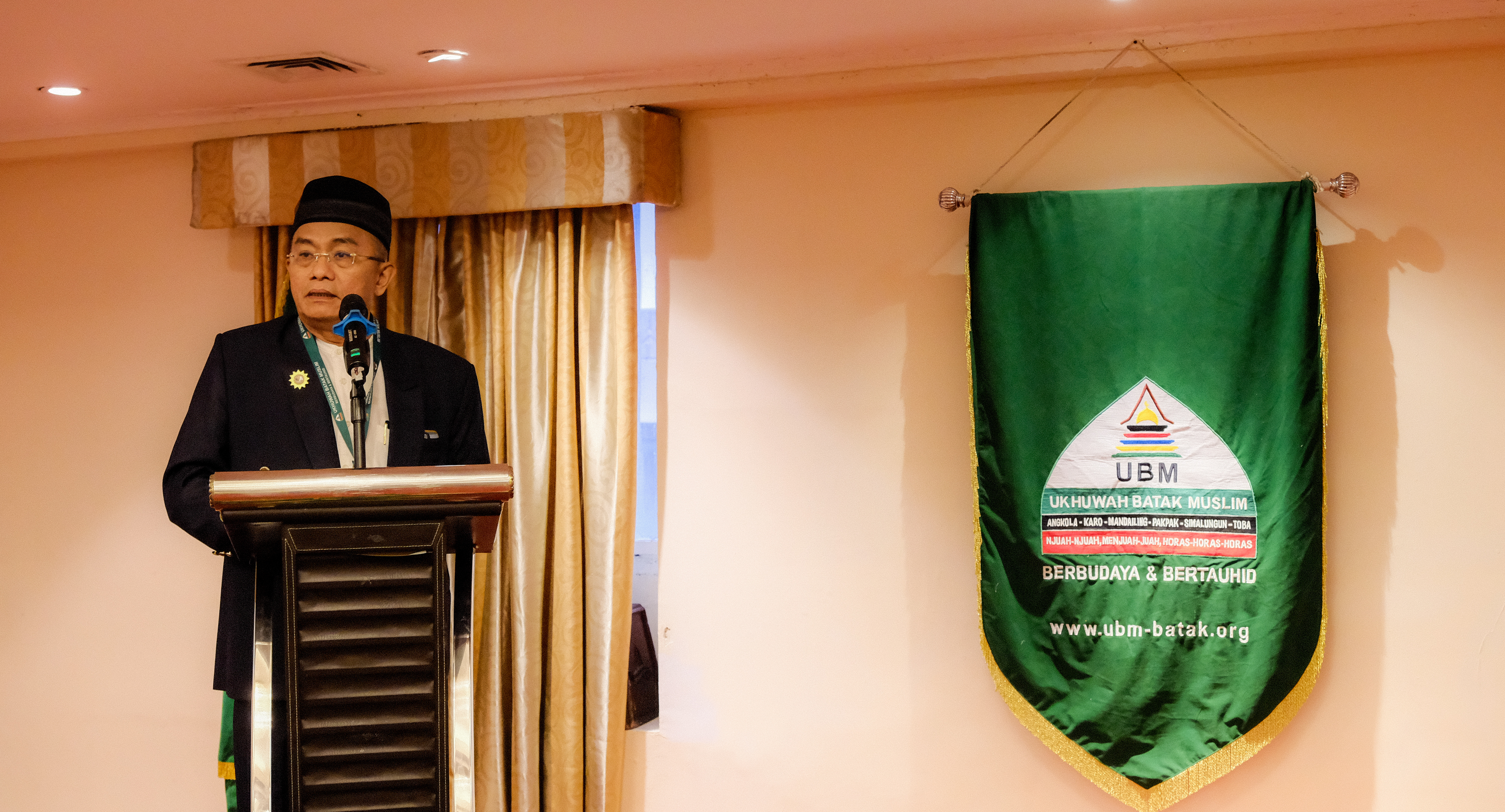 <span  class="uc_style_uc_tiles_grid_image_elementor_uc_items_attribute_title" style="color:#ffffff;">Sambutan Ketua Umum UBM DR. H. Marhaban Sigalingging</span>